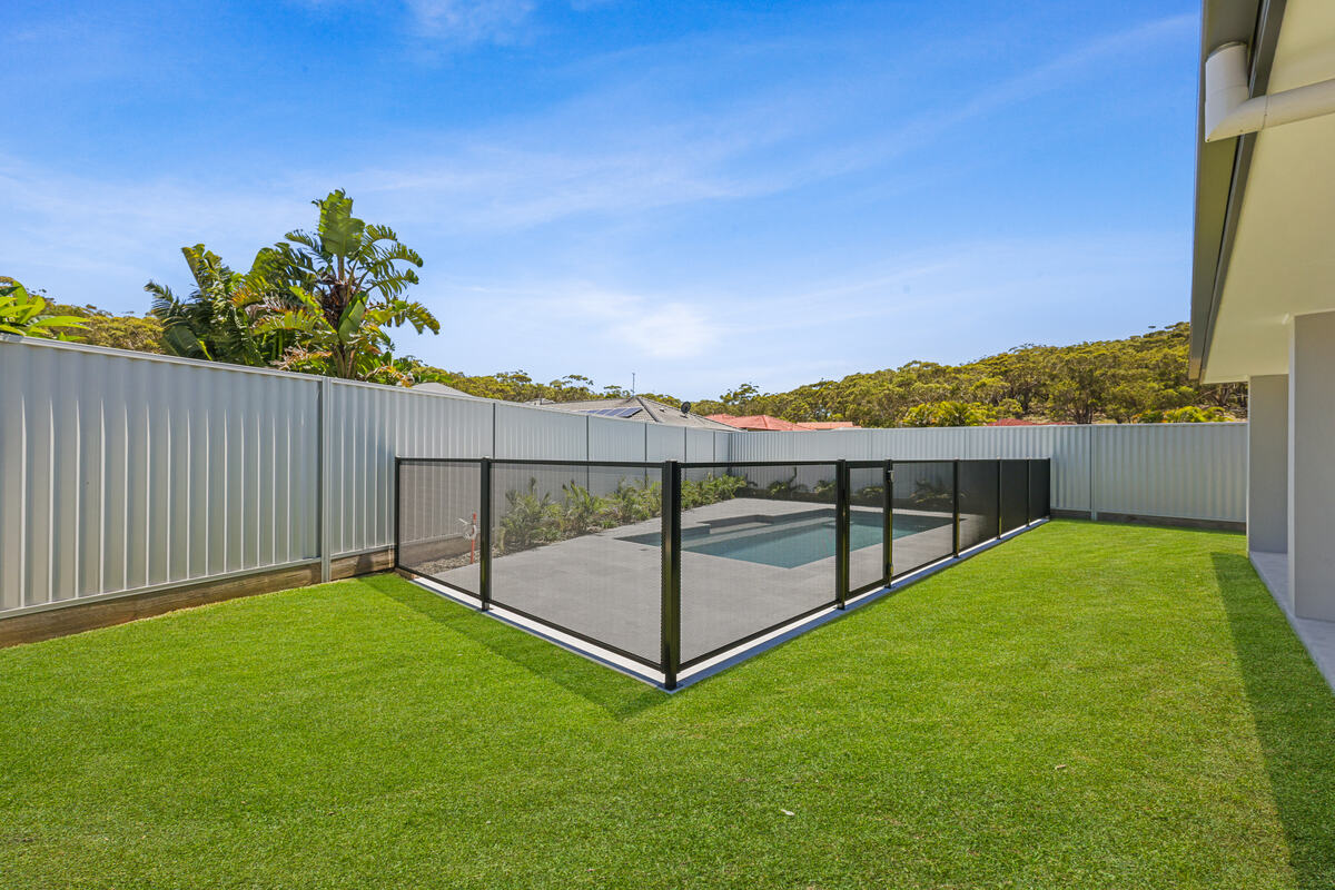 Pure Perf pool fencing in Textured Black with palms and lawn, Port Macquarie